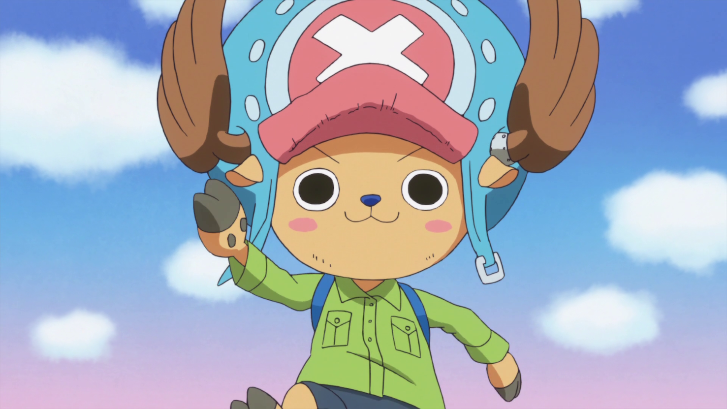 Chopper, pelos marrom claro, bochecas rosadas, com um chapéu azul e vermelho